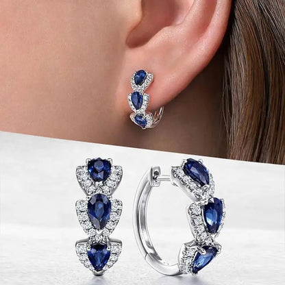 Kunglig Safir Crest Örhängen | Vitguld